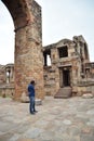 Young man photographer with DSLR camera at Qutub Minar , Delhi, India, Historical Place : Qutub Minar, Delhi, India, World Tallest