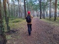 young man photographing forest in spring back view