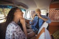 Young man photographing woman from camera Royalty Free Stock Photo