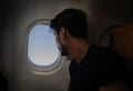 Young man in plane Royalty Free Stock Photo