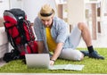 Young man planning his travel online