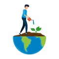 Young man planting tree in the planet earth Royalty Free Stock Photo