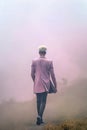 young man with platinum died hair and pink suite. k-pop culture. Royalty Free Stock Photo