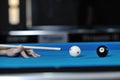 Young man play pro billiard game Royalty Free Stock Photo