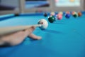 Young man play pro billiard game