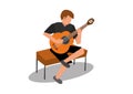 Young man playing an acoustic classical guitar Royalty Free Stock Photo