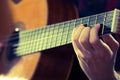 Young man playing acoustic guitar during a concert. - Vintage colours Royalty Free Stock Photo