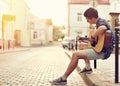 Young man playing on acoustic guitar - outdoor Royalty Free Stock Photo