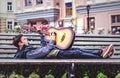 Young man playing on acoustic guitar outdoor Royalty Free Stock Photo