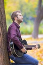 Young man playing acoustic guitar Royalty Free Stock Photo