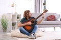 Young man playing acoustic guitar Royalty Free Stock Photo