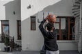 Young man playing basketball outdoors in the backyard shooting a ball at the rim |  Natural image | Slam Dunk Royalty Free Stock Photo