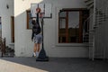 Young man playing basketball outdoors in the backyard shooting a ball at the rim |  Natural image | Slam Dunk Royalty Free Stock Photo