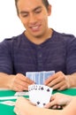 Young man playing cards cuarenta traditional