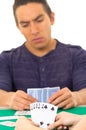 Young man playing cards cuarenta traditional