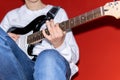 Young man playing electric guitar. Music, instrument education, entertainment, rock star, music conc Royalty Free Stock Photo