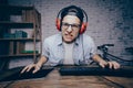 Young man playing game at home and streaming playthrough or walk Royalty Free Stock Photo