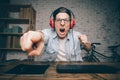 Young man playing game at home and streaming playthrough or walkthrough video Royalty Free Stock Photo