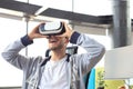 Young man playing game using virtual reality headset in the playing club Royalty Free Stock Photo