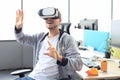 Young man playing game using virtual reality headset in the playing club Royalty Free Stock Photo