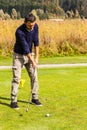 Young man playing golf Royalty Free Stock Photo