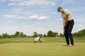 Young man playing golf Royalty Free Stock Photo