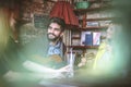 Young man playing guitar in cafe to his friends.