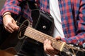 Young man playing guitar, close up view Royalty Free Stock Photo