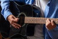 Young man playing guitar, close up view Royalty Free Stock Photo