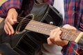 Young man playing guitar, close up view Royalty Free Stock Photo