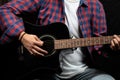 Young man playing guitar, close up view Royalty Free Stock Photo