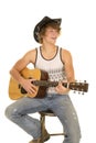 Young man playing a guitar with cowboy hat smile Royalty Free Stock Photo