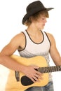 Young man playing a guitar with cowboy hat tank top Royalty Free Stock Photo