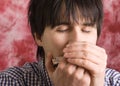 Young man playing harmonica