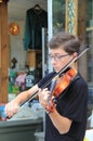 Young man playing instrument for passerbys,Saratoga Springs,New York,2014 Royalty Free Stock Photo