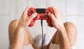 Young man playing online video games - Close up male hands gamer having fun on new technology console