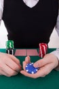 A young man is playing poker