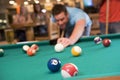 Young man playing pool in a bar Royalty Free Stock Photo