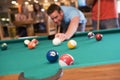 Young man playing pool in a bar Royalty Free Stock Photo