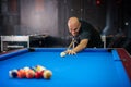 Young man playing pool game in pub Royalty Free Stock Photo