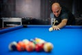 Young man playing pool game in pub Royalty Free Stock Photo