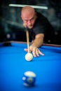 Young man playing pool game in pub Royalty Free Stock Photo