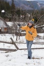 Young man playing snowballs