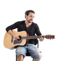 Young man playing a spanish guitar Royalty Free Stock Photo