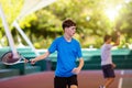 Young man playing tennis on open court Royalty Free Stock Photo