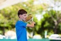 Young man playing tennis on open court Royalty Free Stock Photo