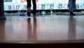 Young man playing tenpin bowling and throw the bowling ball in the lane. Close up back leg view. Tripod footage