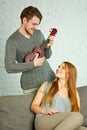 Young man playing ukulele