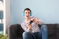 Young man playing video game at home Royalty Free Stock Photo
