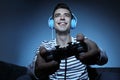 Young man playing video game at home in the evening Royalty Free Stock Photo